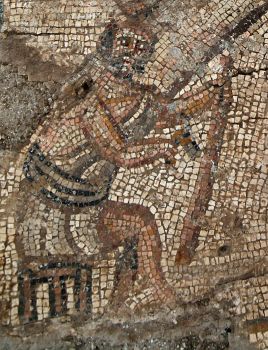 Mosaic floor found at site of newly discovered Galilee synagogue shows workman with woodworking tool (Photo: Gabi Laron)